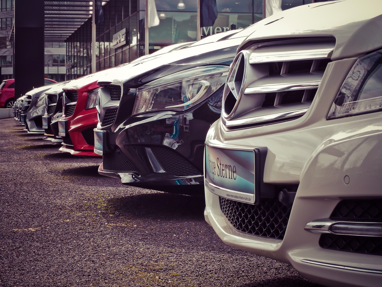 Company cars and commercial vehicles parked together